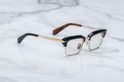 JMM alin noirx side view, black acetate top rim and ilver bottom rim. gold and silver temples 