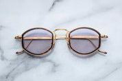 JMM Aragon oval shaped gold frames with innfer tortishell rim and key hold bridge