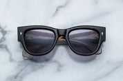 Dark tortise shell sunglass with sterling silver arrow head pin on the sides