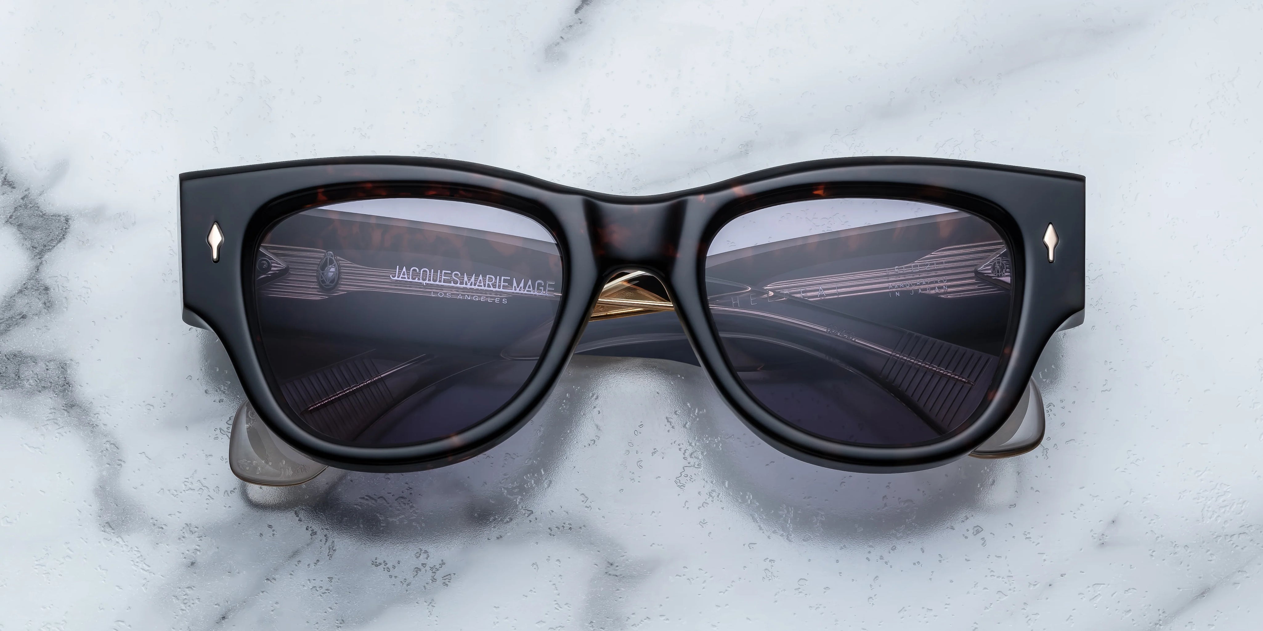 Dark tortise shell sunglass with sterling silver arrow head pin on the sides