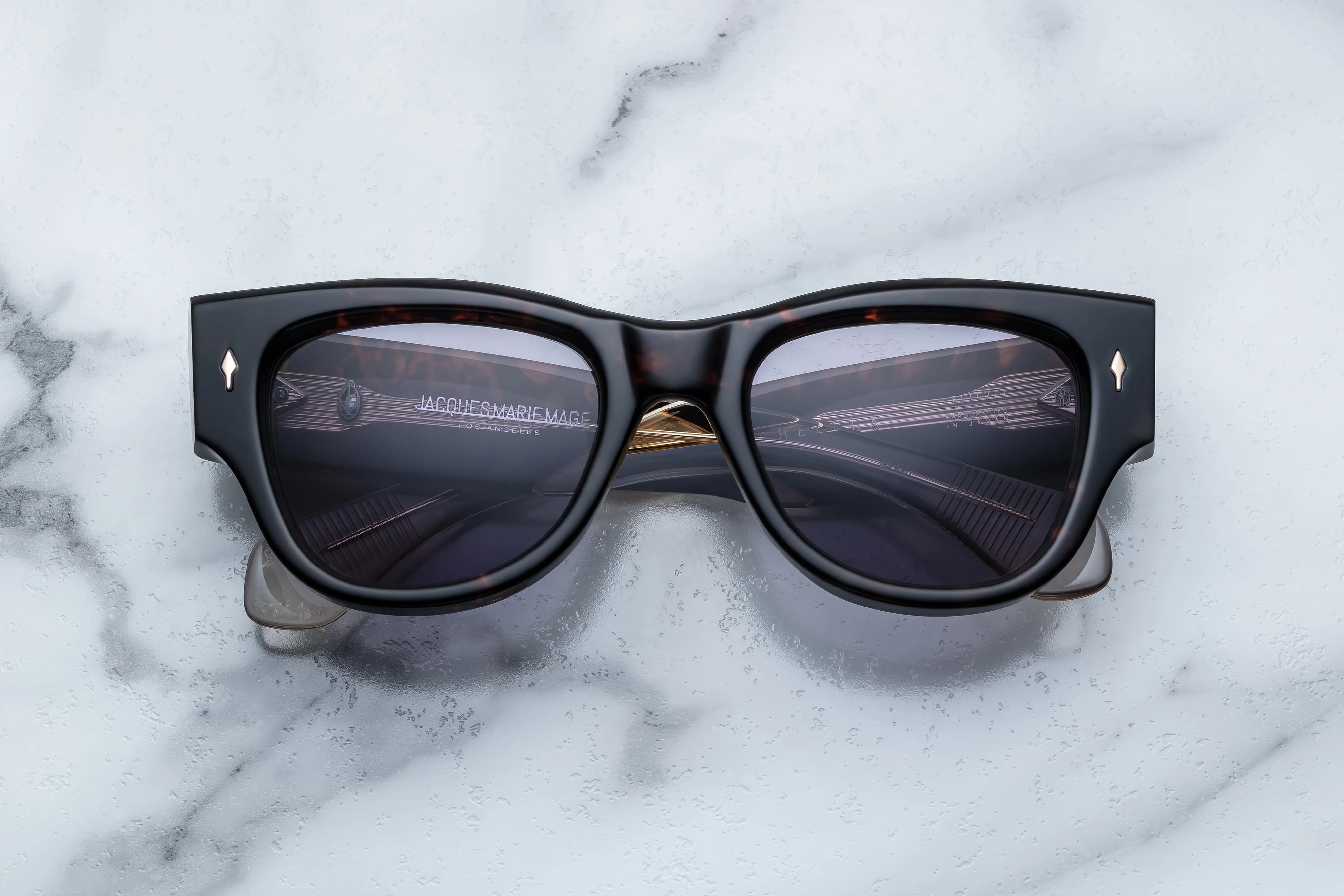 Dark tortise shell sunglass with sterling silver arrow head pin on the sides
