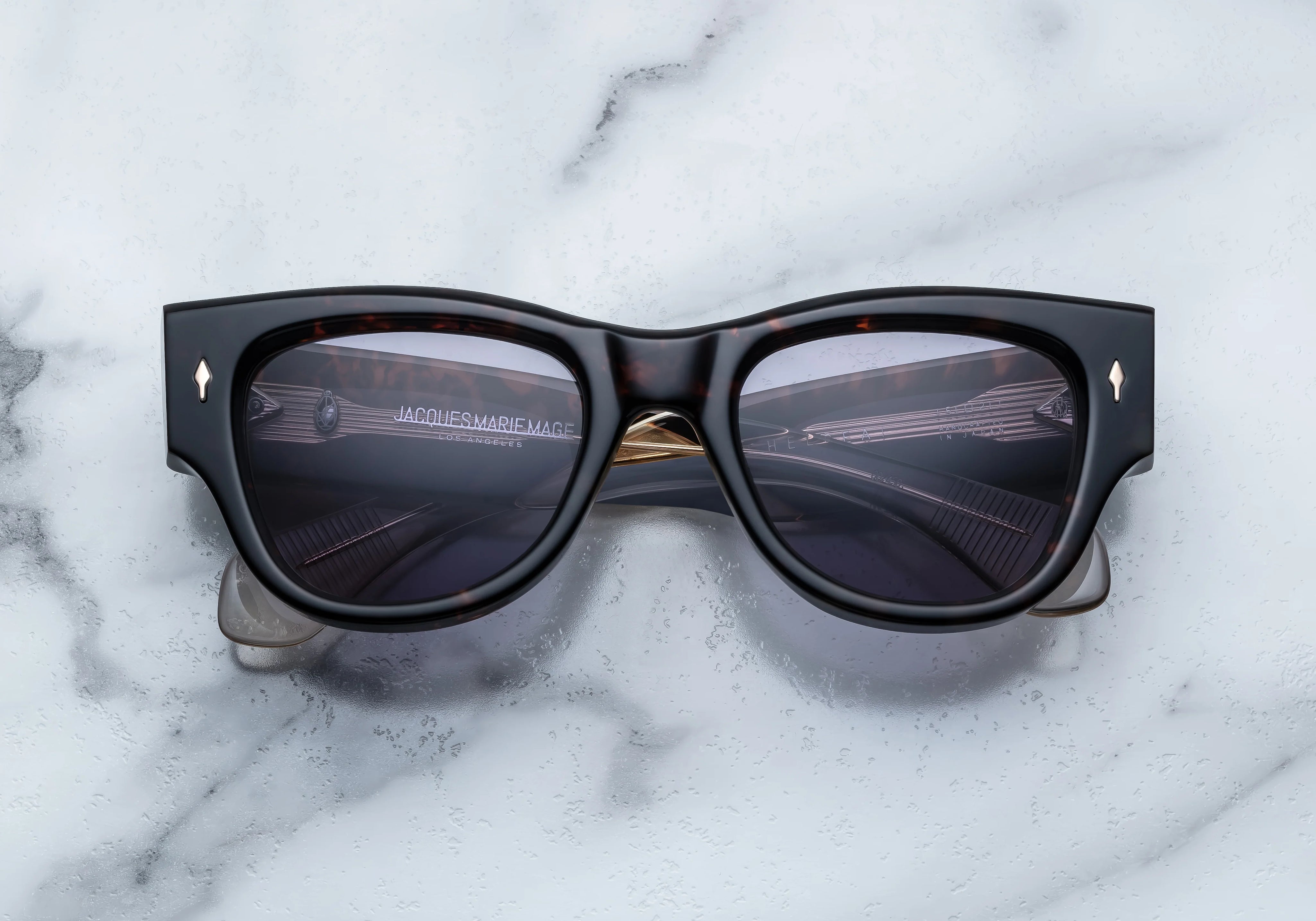 Dark tortise shell sunglass with sterling silver arrow head pin on the sides