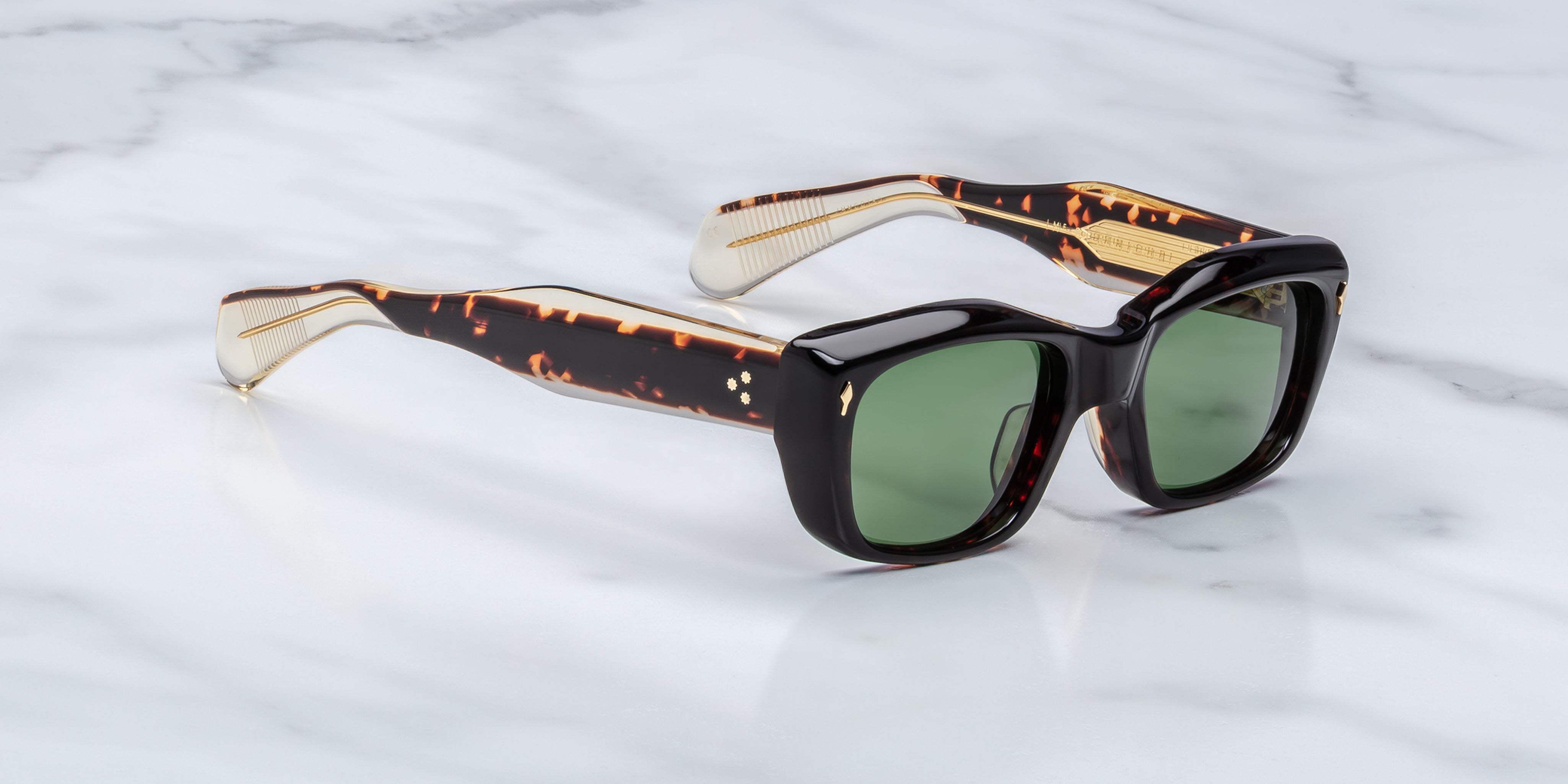 side angle of black sunglasss with tortishell and crystal temples