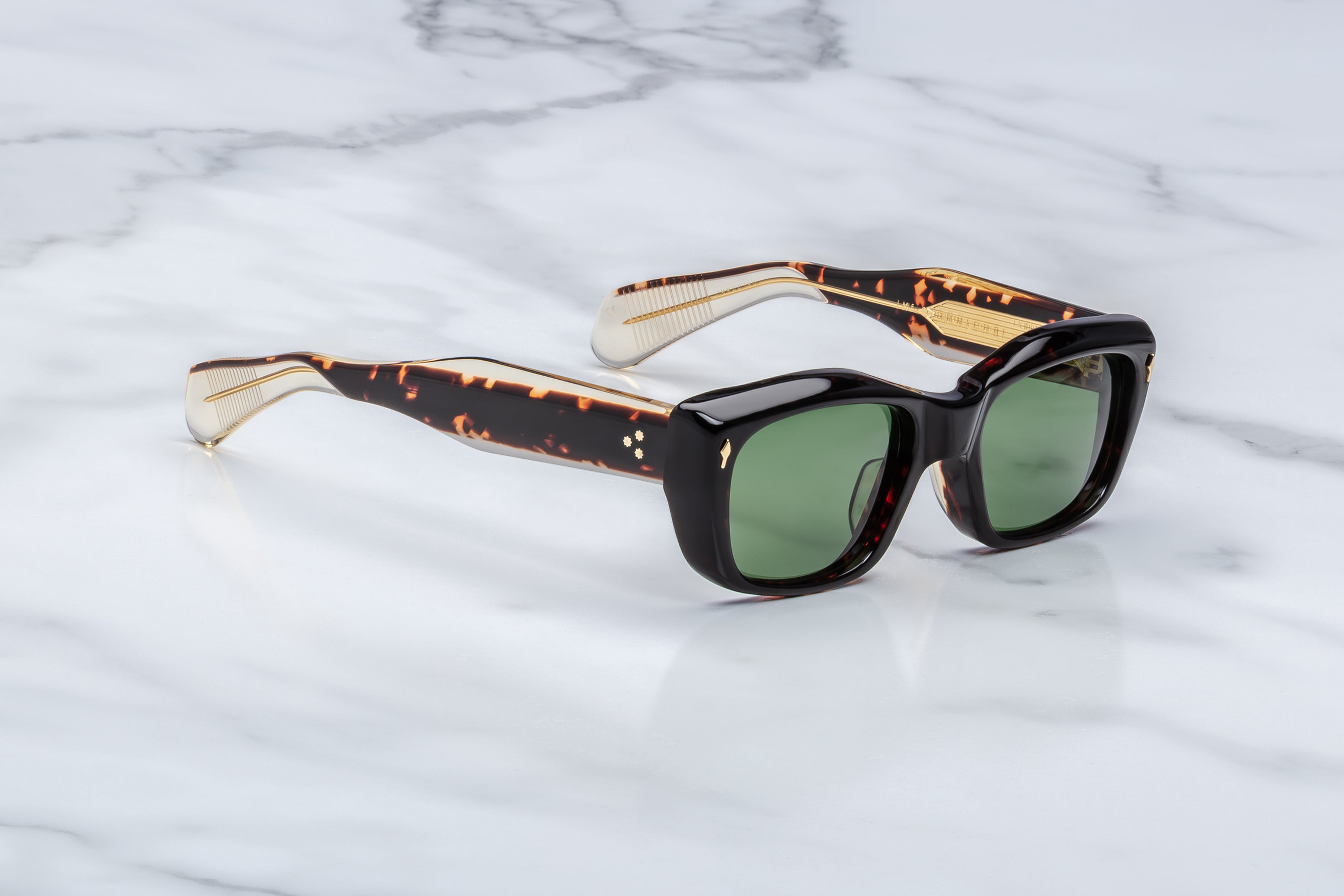 side angle of black sunglasss with tortishell and crystal temples