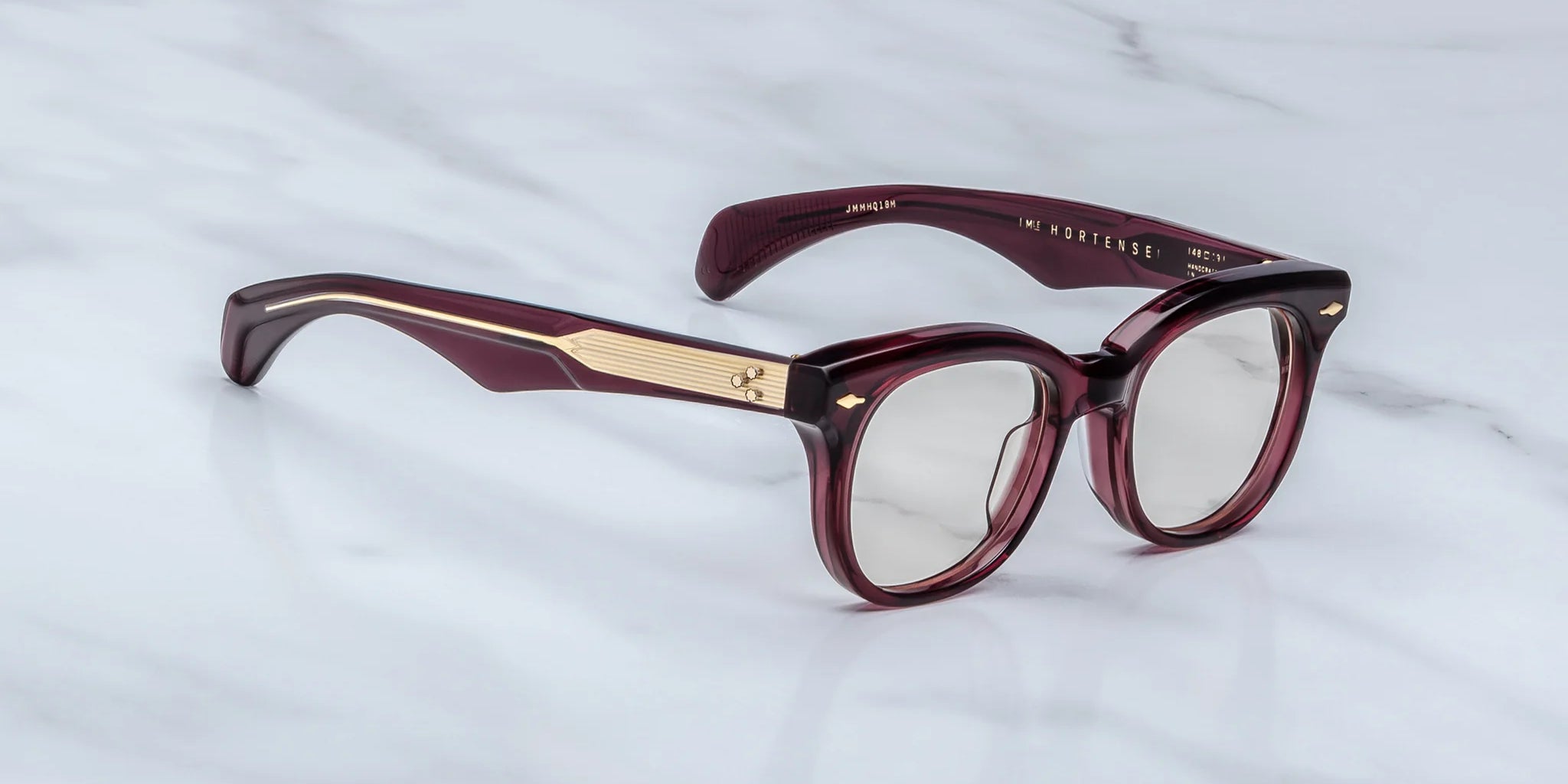 Side view of JM Hortense a Burgundy square frame with rounded edgesand gold detail on temples