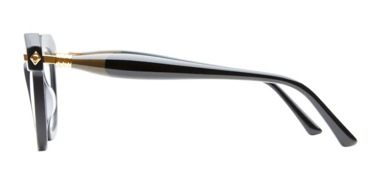 side view of a frame with gold and black temples