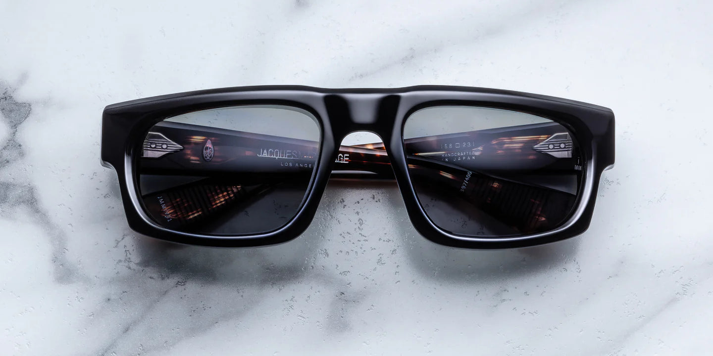 black regctangular sunglass frame with tortishell on the inner temples