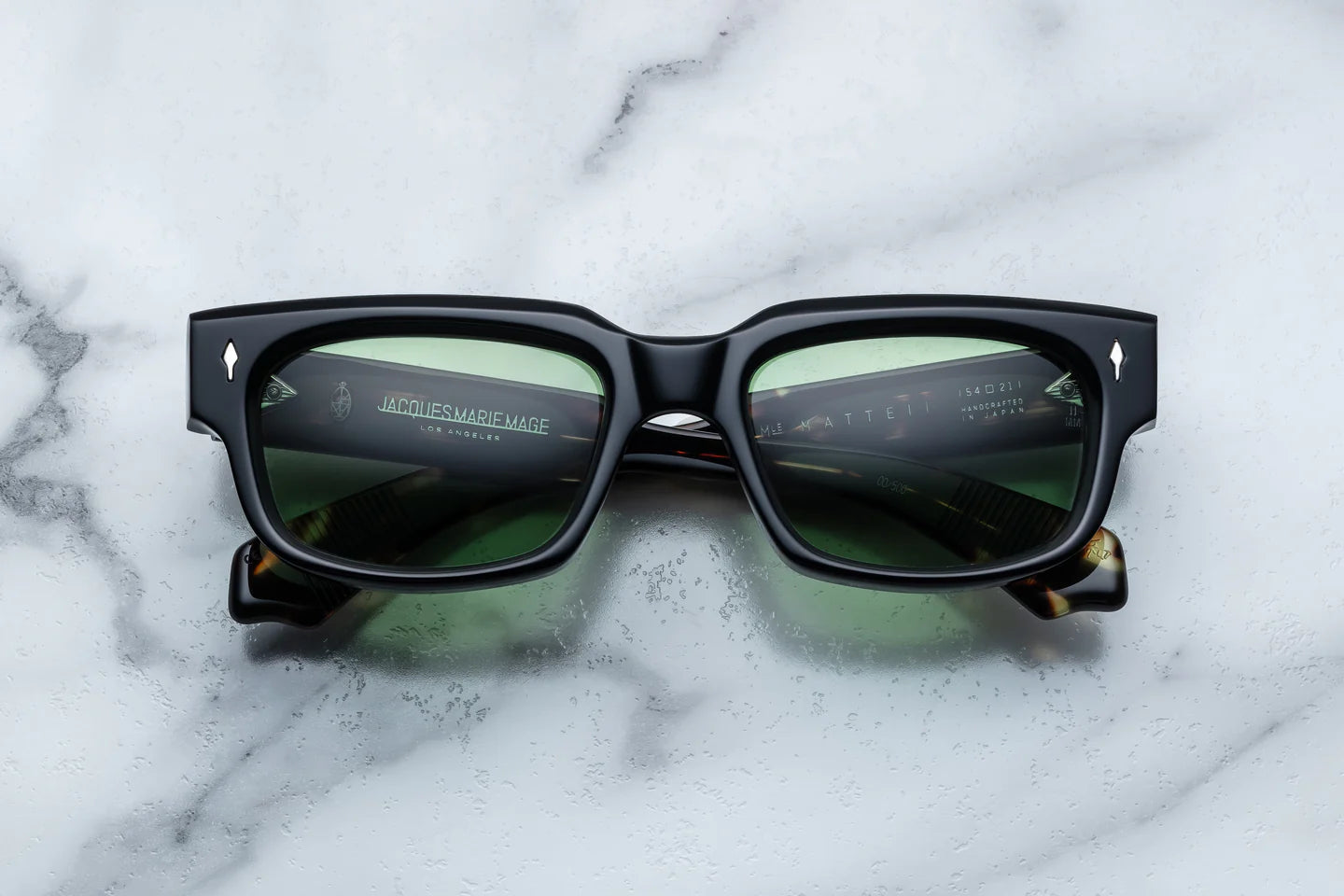black coloured sunglasses with sterling silver arrow head motify on the sides JMM mattei noir