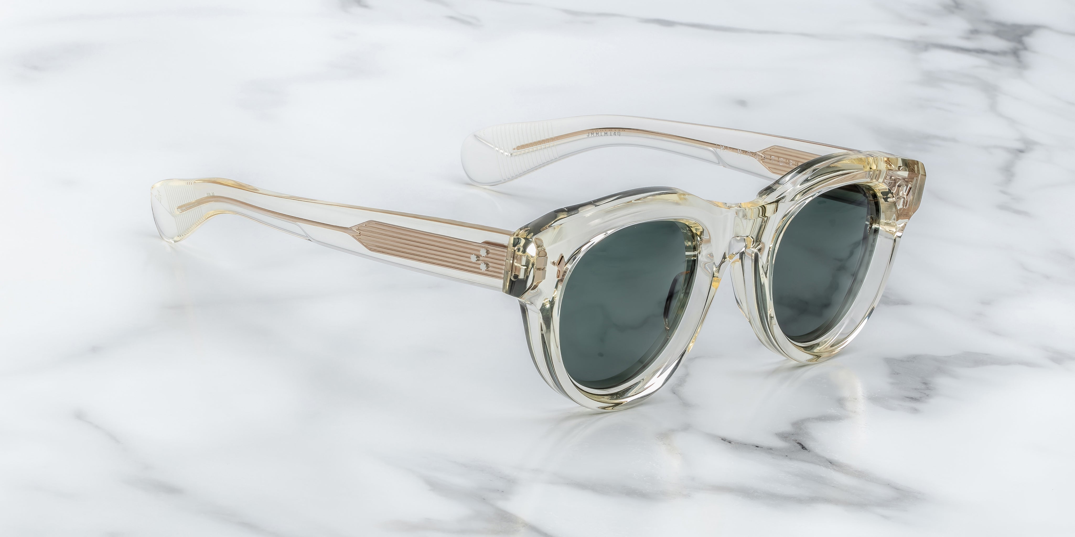 round sunglass in crystal with silver arrow pin motif on the sides side view