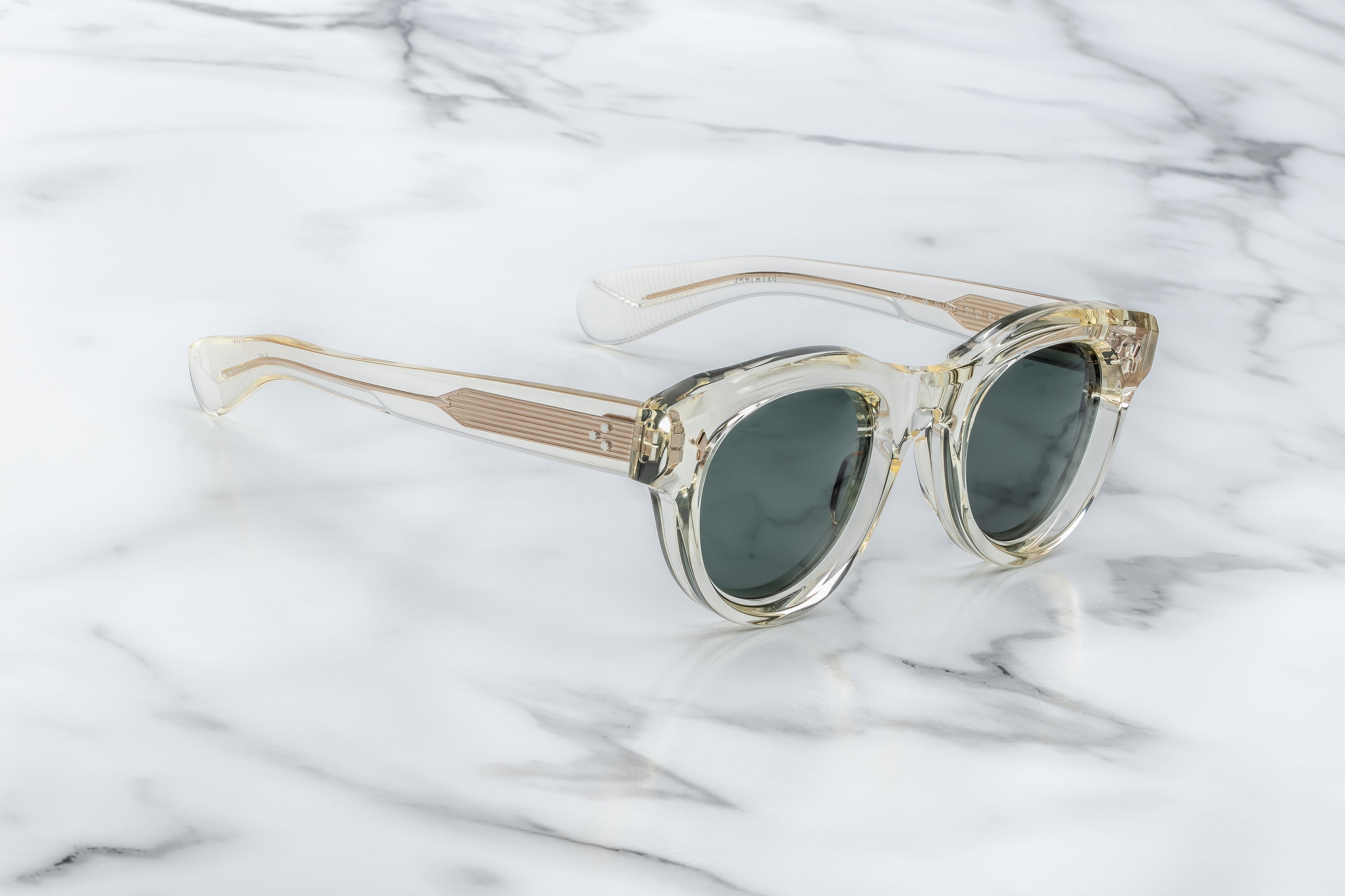 round sunglass in crystal with silver arrow pin motif on the sides side view