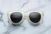 round sunglass in crystal with silver arrow pin motif on the sides