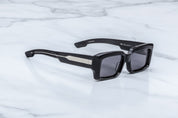 side view of black rectangular sunglass with expose wire core