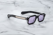 black rectaungualr sunglasses with purple lenses side view and metal detail on the temples