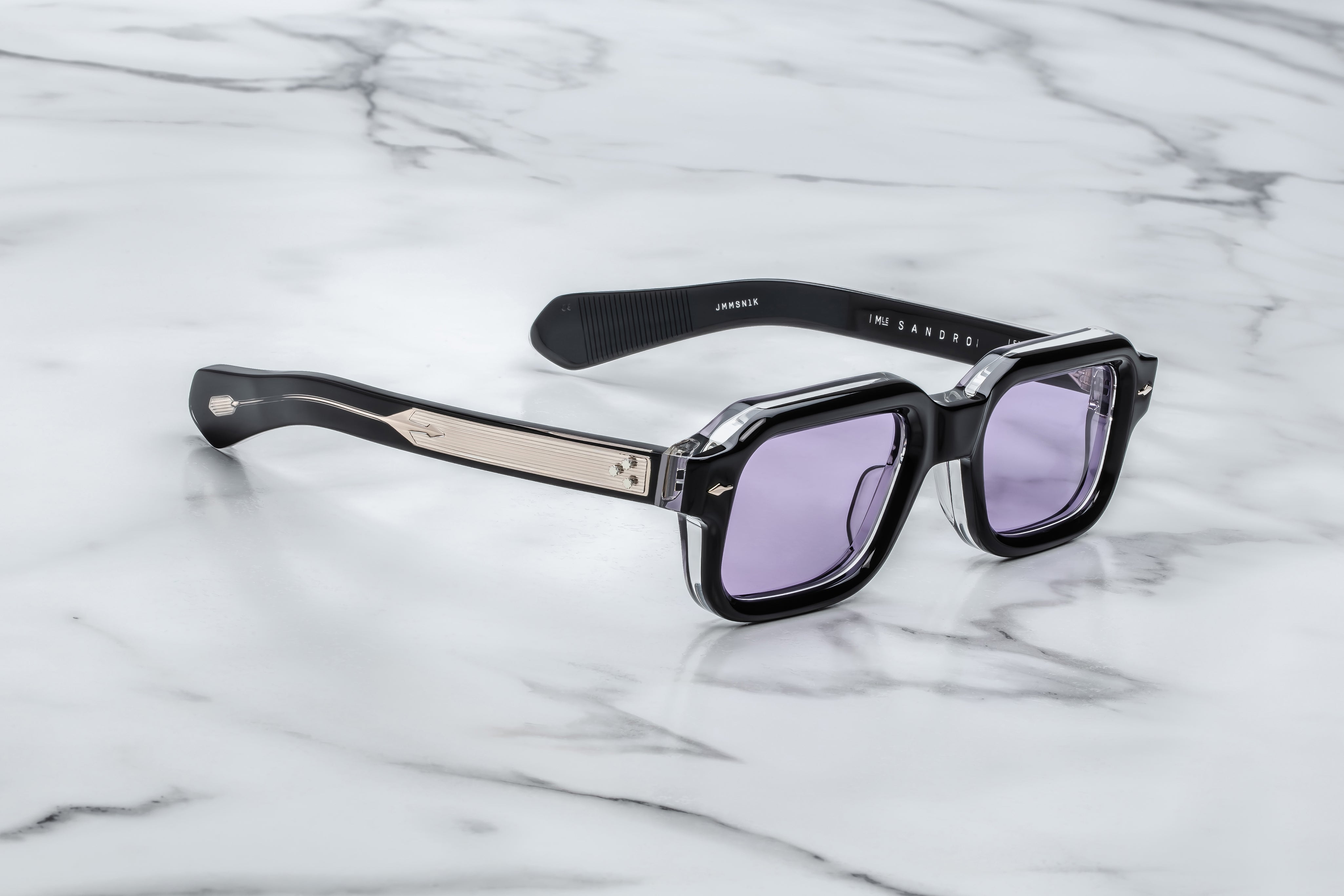 black rectaungualr sunglasses with purple lenses side view and metal detail on the temples