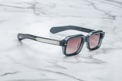 blue rectangular sunglasses with silver detail on temples