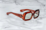 brown sunglasses on a marble surface