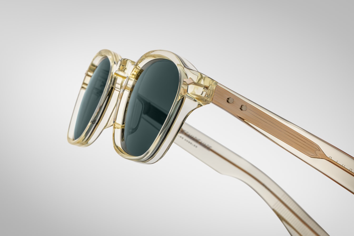 A pair of sunglasses with a distinctive frame, sculptural temples, and a sophisticated silhouette. with detail on the temples