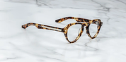 side view of aviator shaped tortoise shell frame with metal detail on frame