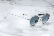 Silver metal aviator style sunglass with double bridge and acetate finish at the top side view