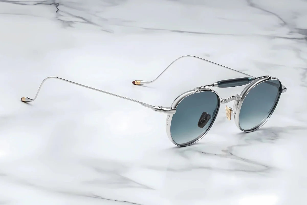 Silver metal aviator style sunglass with double bridge and acetate finish at the top side view