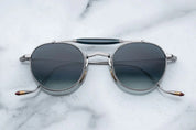 Silver metal aviator style sunglass with double bridge and acetate finish at the top 