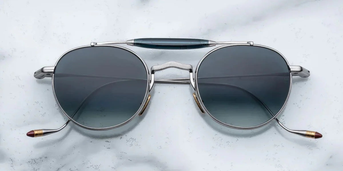 Silver metal aviator style sunglass with double bridge and acetate finish at the top 