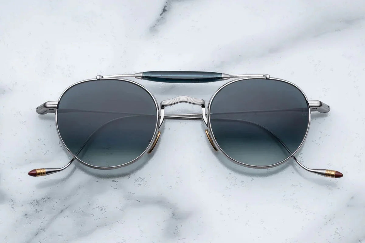Silver metal aviator style sunglass with double bridge and acetate finish at the top 
