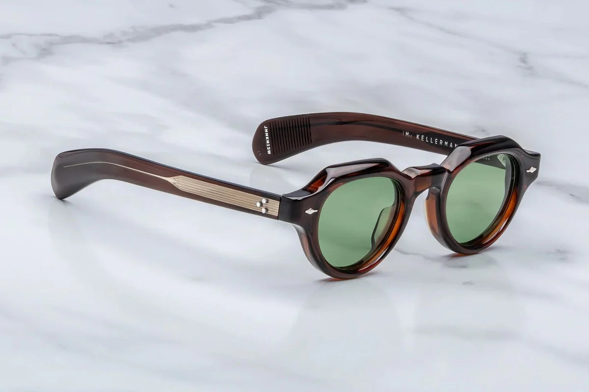 A pair of jacques marie mage frames with panto shape in a transparent brown side view