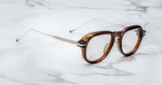 aviator style acetate frme in translucent broand and silver temples side view