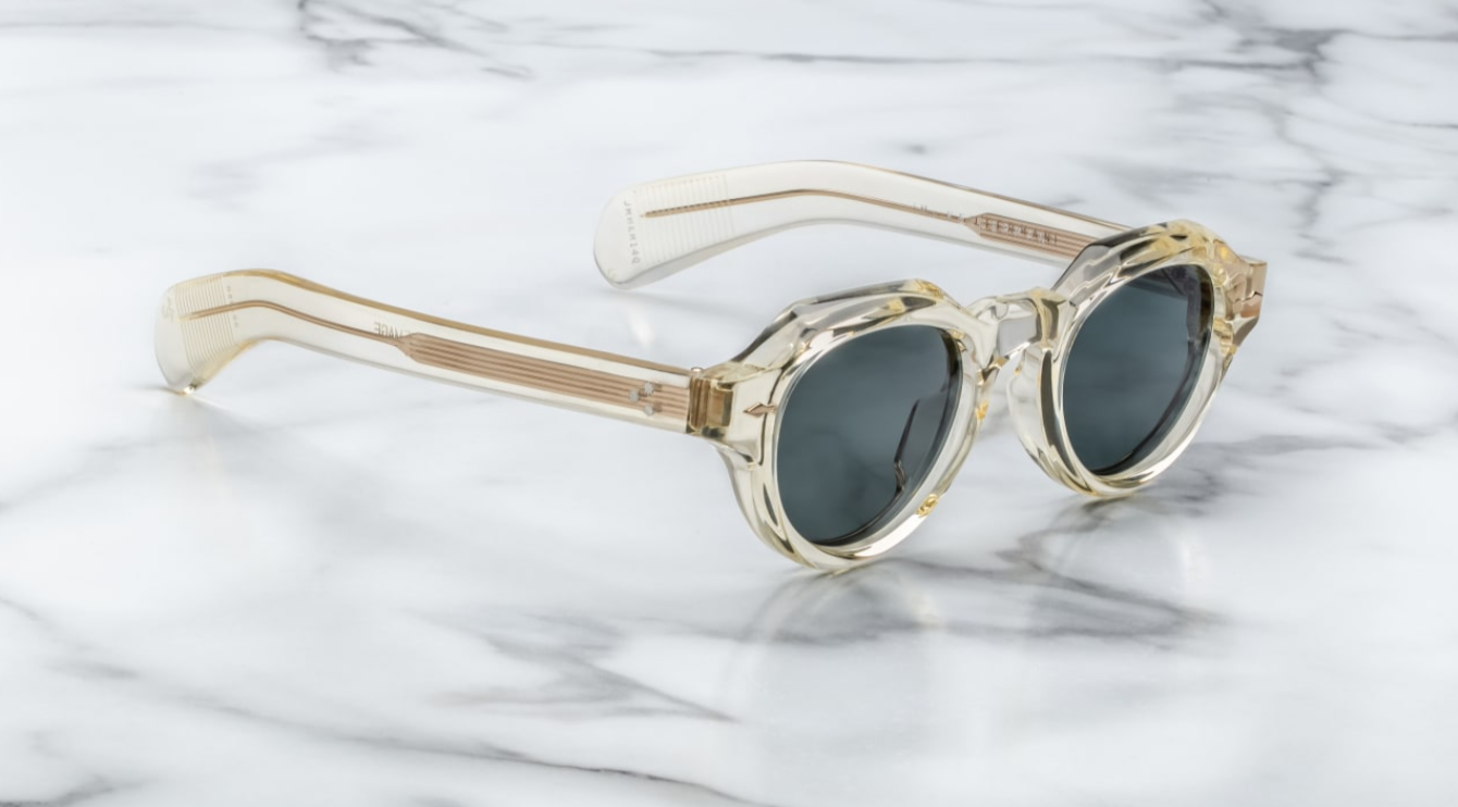 A pair of jacques marie mage frames with panto shape side on vie of the kellerman in a transparent champagne colour